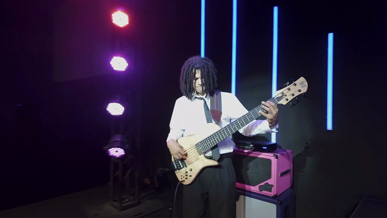 Bass player on a five string bass during a live set