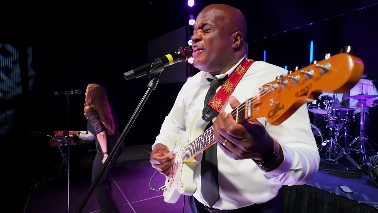 Lead vocal and guitar during a live set