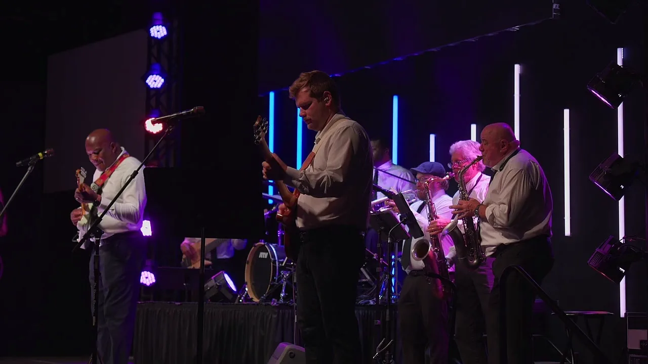 The horn section playing during a live set