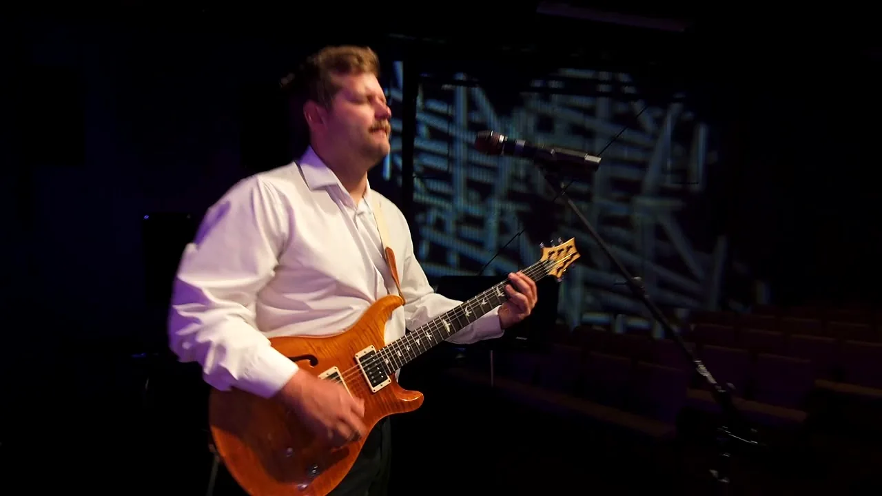 Guitarist playing during a live set