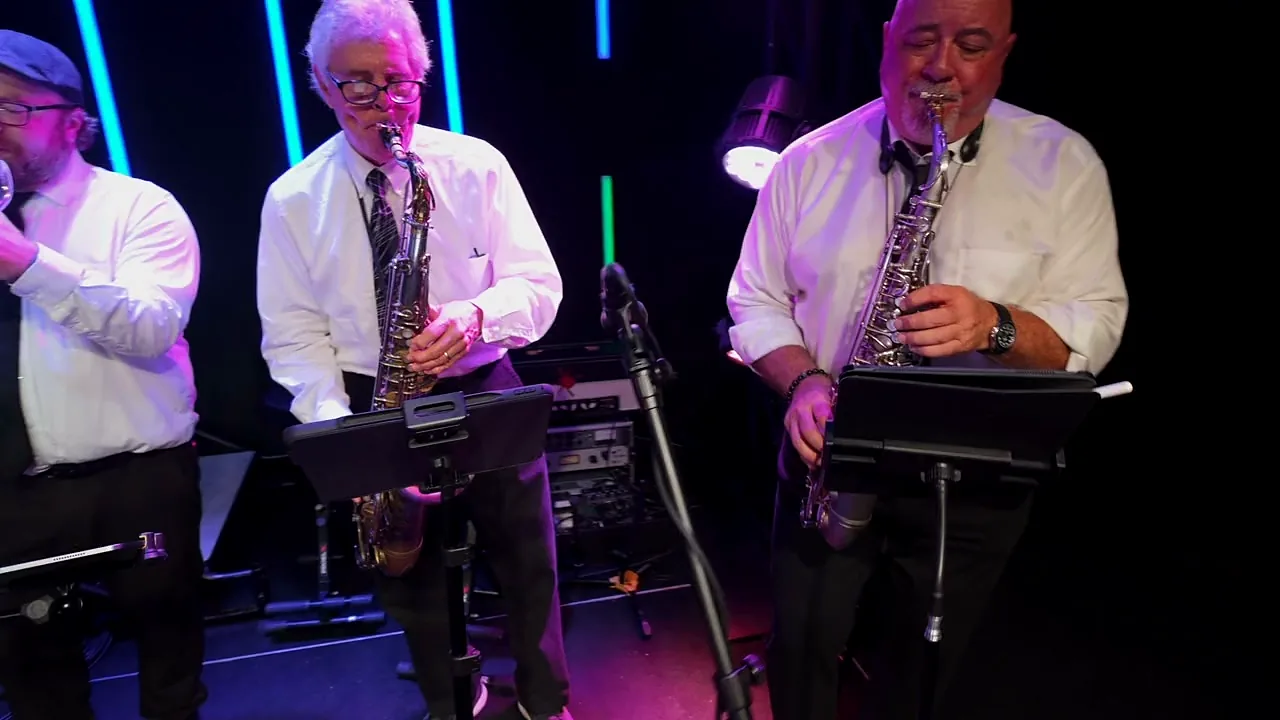 The horn section playing during a live set